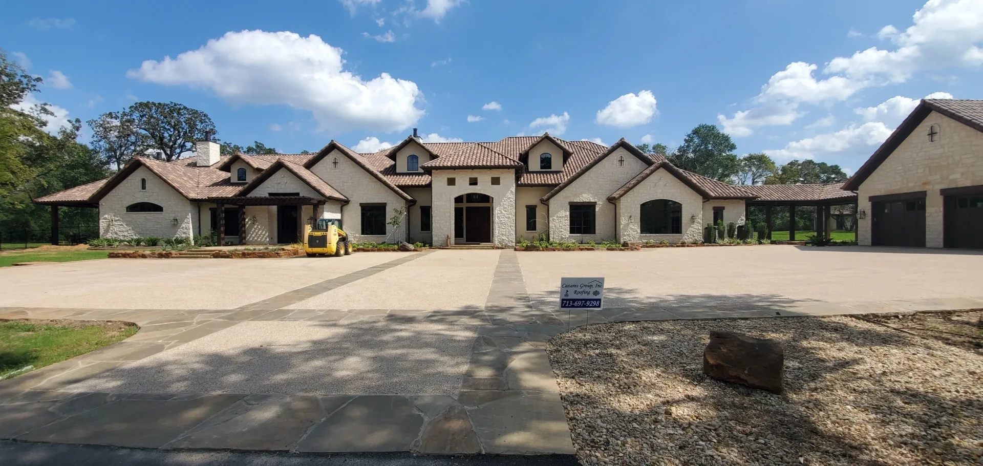 Large custom home with stone and brick exterior.