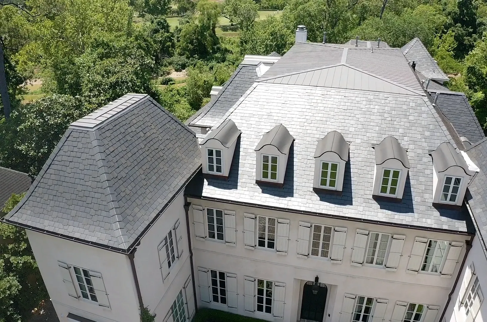 A slate roof on a French-style house.