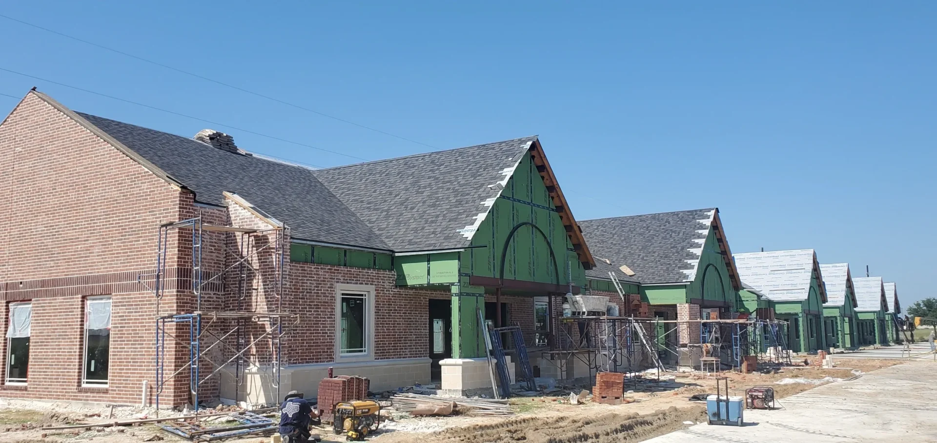 A row of commercial buildings under construction.